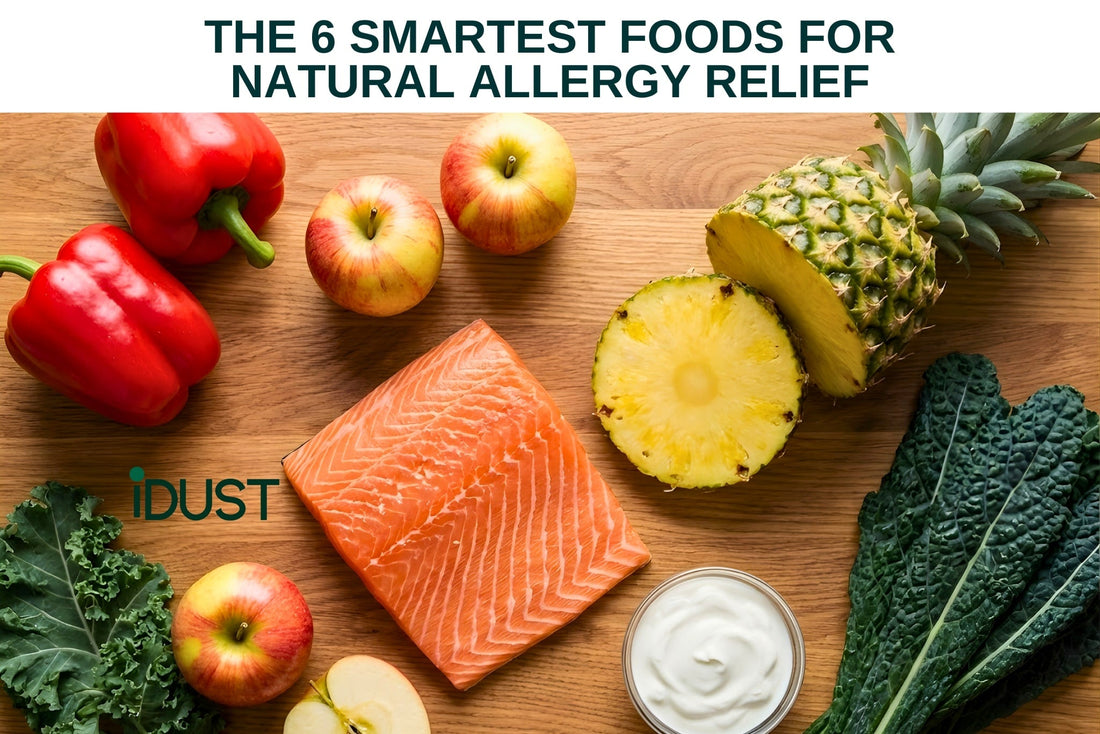 Flat lay of anti-inflammatory allergy-fighting foods including salmon, red peppers, apples, pineapple, and leafy greens.