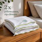 Two folded anti dust mite eucalyptus silk pillowcases with zip closure and green piping, set of 2