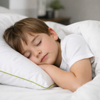 Child sleeping peacefully in bed with anti dust mite pillow case and duvet