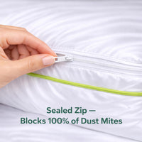 Hand zipping a white pillowcase with text about dust mite blocking.