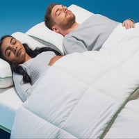 Couple sleeping under anti dust mite duvet cover for allergy relief